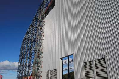 Cladding proceeds on the main process building