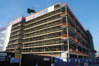 Scaffolding has been erected to allow the installation of the cladding system