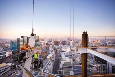 No time to take in the view as steel erectors complete a bolted connection 