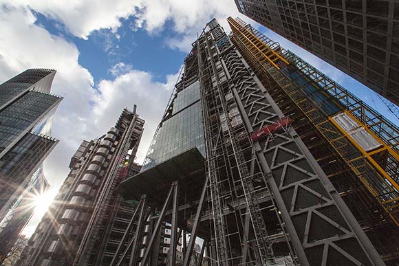 The yellow steelwork north core houses the lifts and service risers