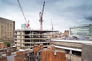 The John Lewis store takes shape while the steel trusses for the redeveloped station (right of picture) are assembled in readiness for erection