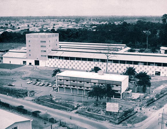 General view of the new Guinness Brewery at Ikeja, Nigeria, 14 miles from Lagos. Most buildings are of simple rolled steel and tubular framed construction except for a purpose-built brewing tower. 