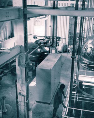 General view of the mash tun stage. Steelwork is extensively used to support the special brewing equipment.