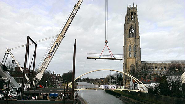 Landmark bowstring bridge lifted into place at Boston