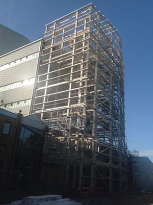 The new steelwork connects to the existing steel framed building