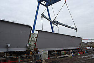 Girder sections are welded together onsite before being launched