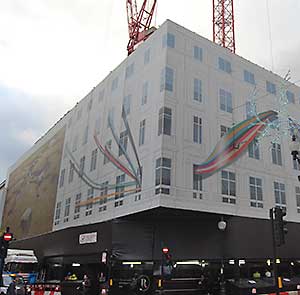 Hoardings cover the façades and hide the construction work