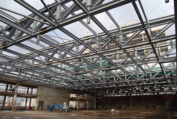 A series of steel trusses form the large open ballroom