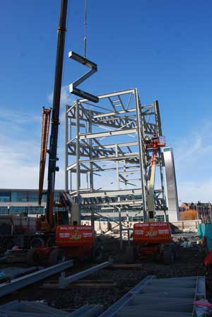 Z-shaped bracing is lifted into place