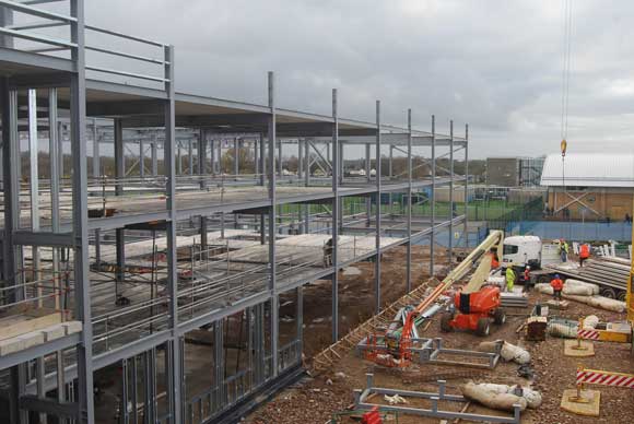 Steelwork goes up in front of Longdean’s retained sports hall