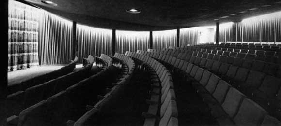 The auditorium seats 400 and was formerly the basement. Particularly noticeable is the three dimensionally curved ceiling of anti-clastic profile enabling the use of beams of small depth
