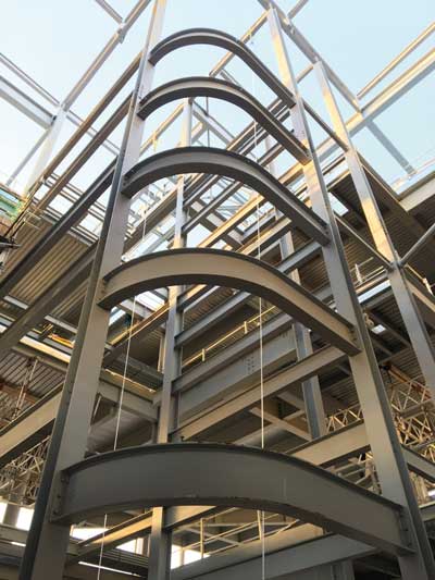 Curved members form the internal façade of the hub