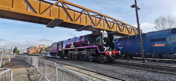 Weathering steel footbridge spans Kidderminster main line and heritage railway