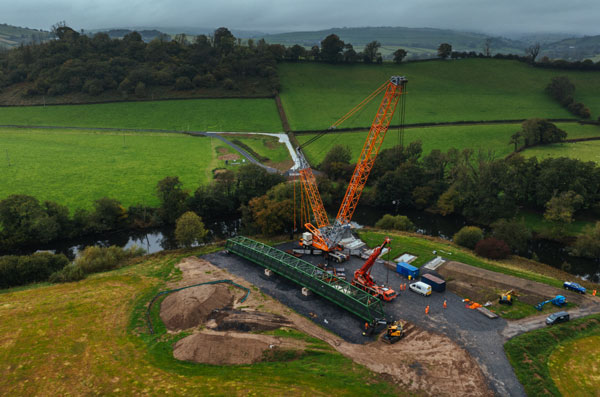 Welsh walking trail on track with steel footbridges Welsh walking trail on track with steel footbridges
